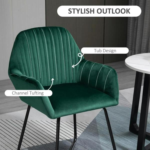 Green velvet-touch accent chair with channel tufting and curved arms, black metal base
