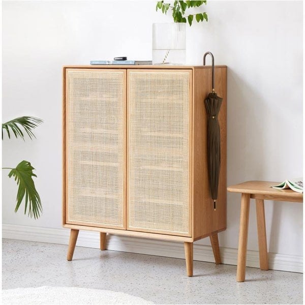 Hans Rattan Shoe Storage Cabinet, Oak in a lifestyle setting with cabinets with handles