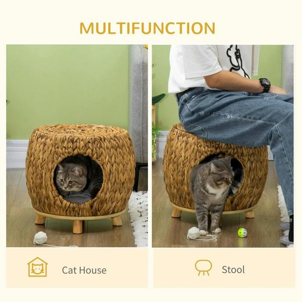 Round wicker cat house with grey cushion and front entrance, with a cat inside