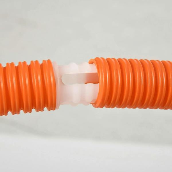 Close-up of orange interlocking rib connector for dog agility equipment