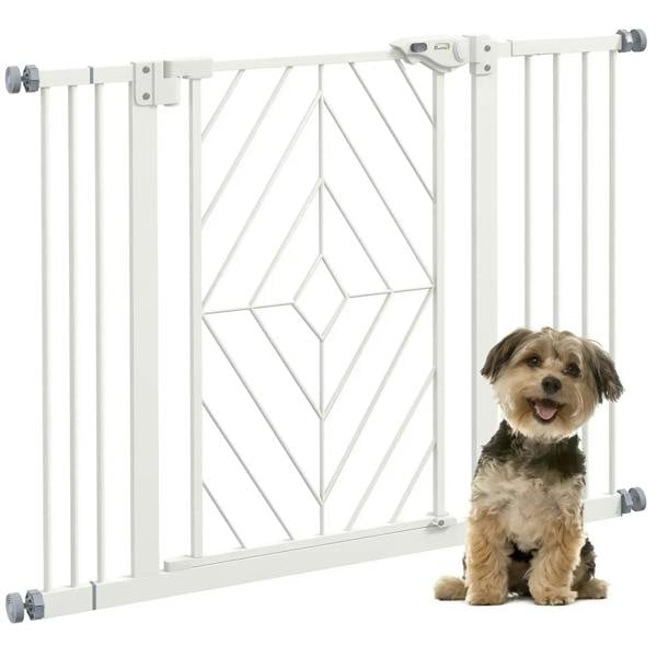 White pressure-mounted dog stair gate with arched door latch and small dog nearby