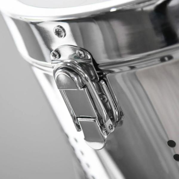 Close-up of chrome lamp head mechanism with hinge and screws