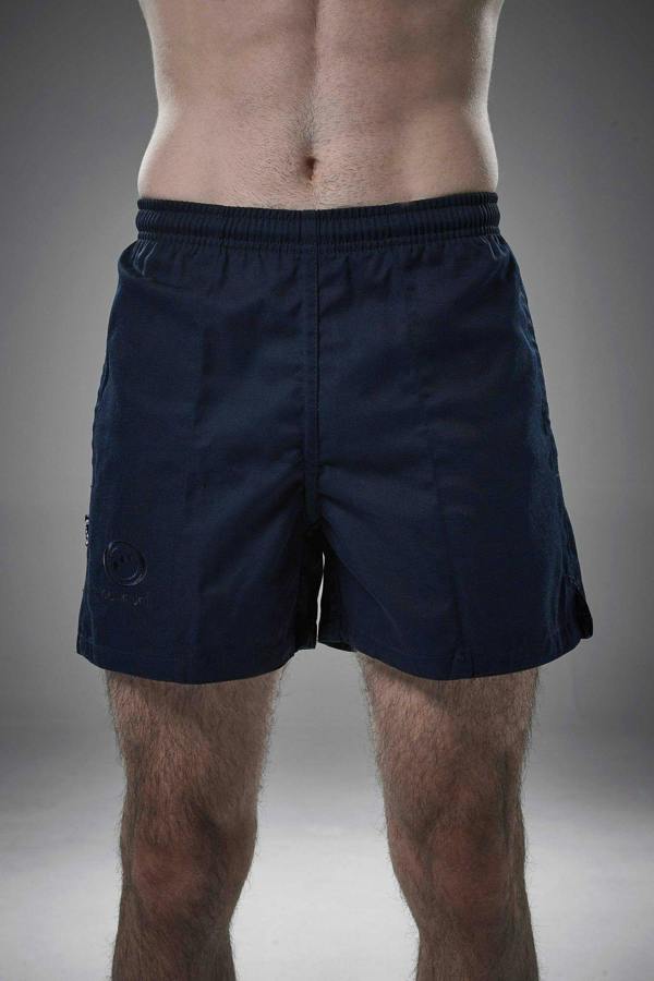 Man wearing navy Optimum Auckland rugby shorts front-on with tonal logo on leg, grey background - Optimum