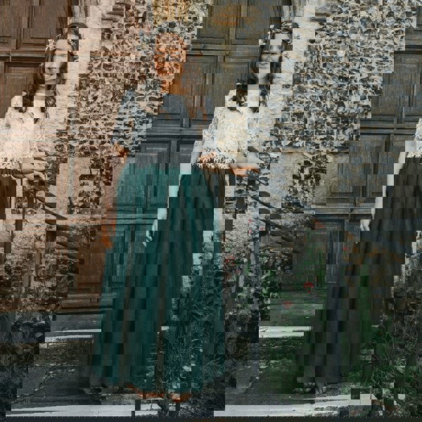 bridesmaid wearing hunter green skirt and lace top