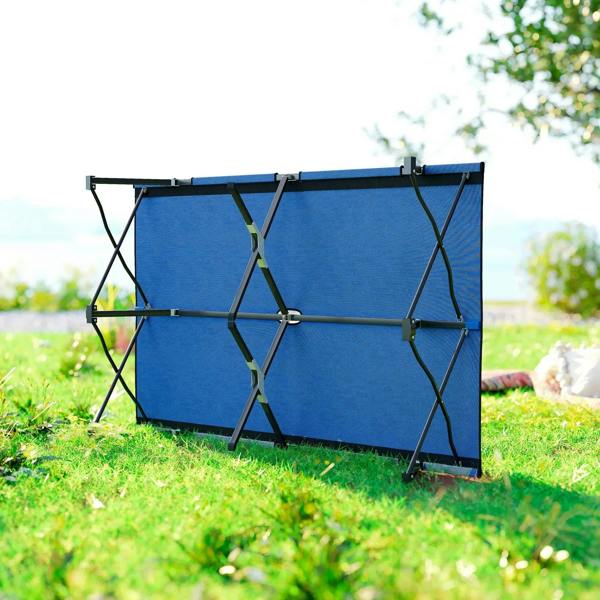 Blue double camping cot bed with black support frame and canvas-style fabric.