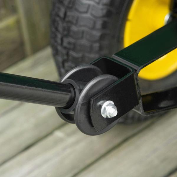 Close-up of axle bracket and wheel on green garden cart