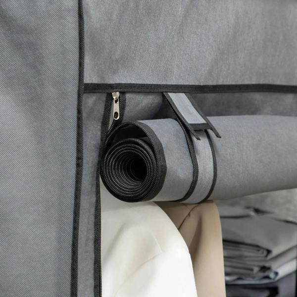 Dark grey fabric wardrobe side pocket holding rolled accessory storage strap and roll.
