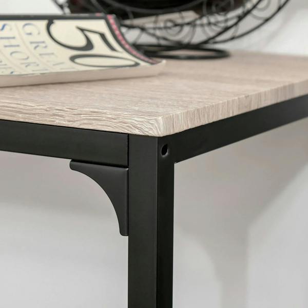 Close-up of bar table corner: light wood top with dark metal leg and bracket