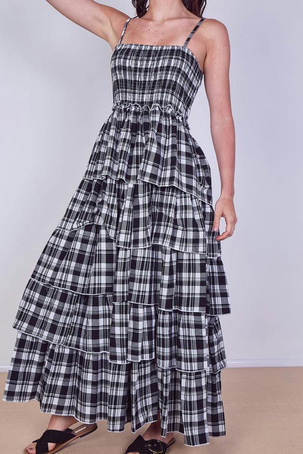 Black and white plaid dress with tiered layers on a plain background