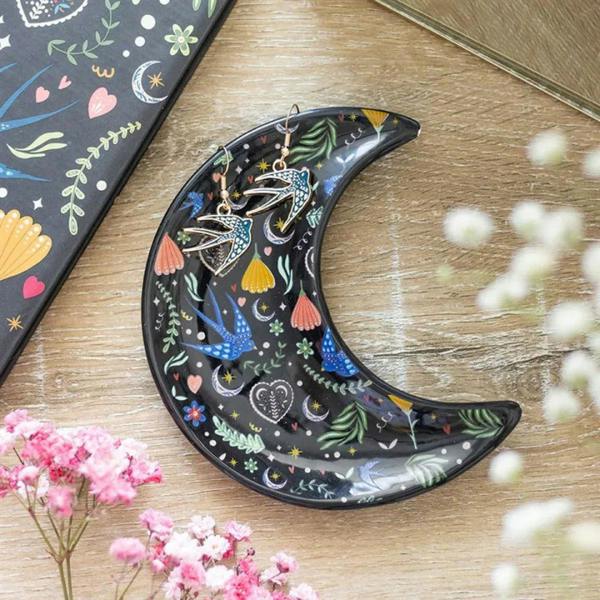 Crescent moon trinket dish, dark glossy black with colorful hearts, birds, and stars.