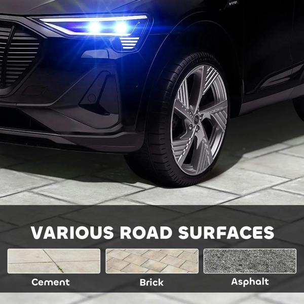 Black ride-on car front wheel and glowing LED light detail