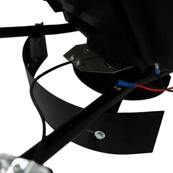 Close-up of an ATV mounted spreader showing the black metal frame, adjustable spreader plate, and wiring for easy attachment