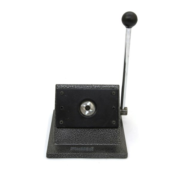 Heavy-duty badge maker with a sturdy black base, chrome lever, and a shiny circular punch for creating custom badges