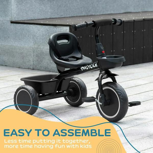 Black kids tricycle with front basket and three EVA-style wheels at side view