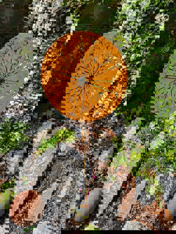 rusty metal flower stake