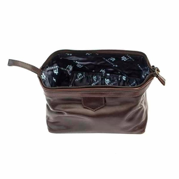 Open view of Brown leather washbag on a white background