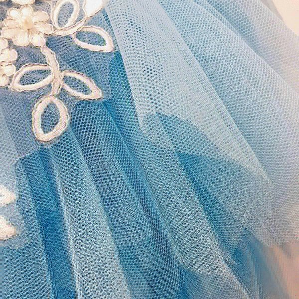 blue tulle on a girls party dress