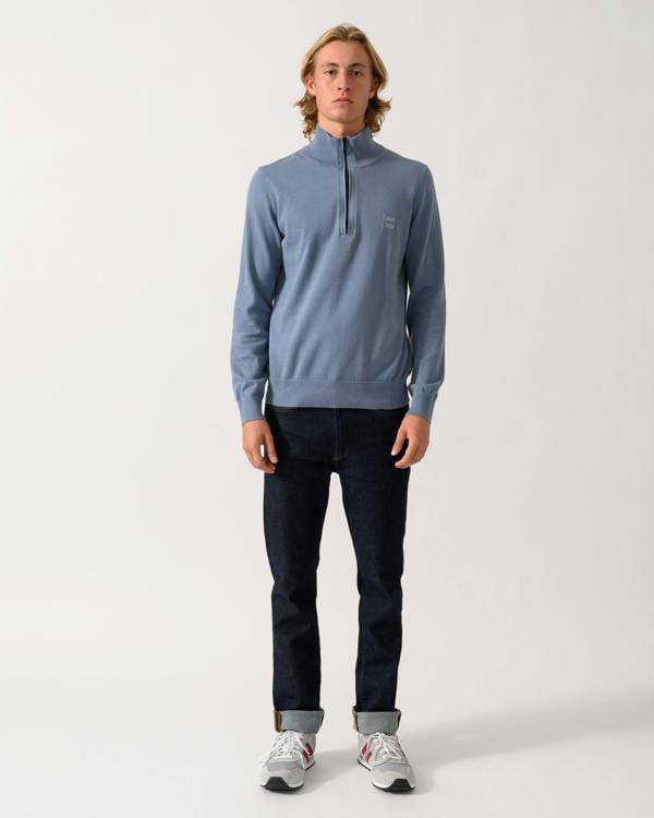 full length of a model wearing a BOSS Orange Kanobix S Mens 1/4 Zip Jumper in Medium Blue 424