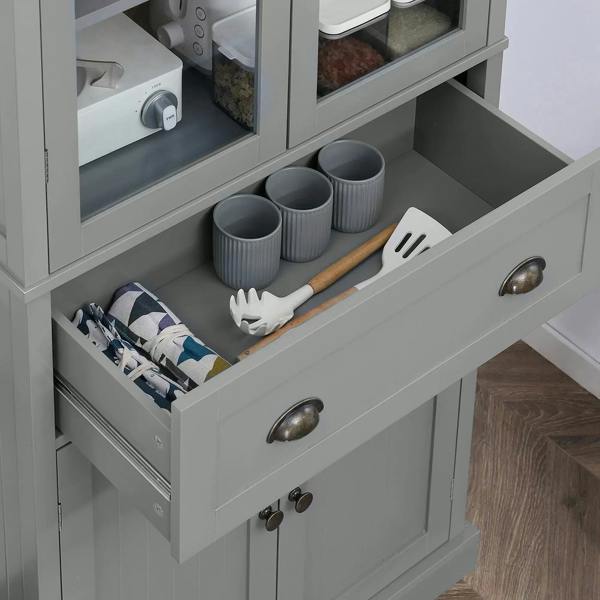 Grey pantry drawer with utensil organizer compartments and metal cup pulls