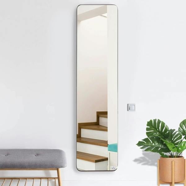 Black full-length mirror with thin frame, wall leaning view, rounded corners