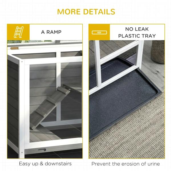 Grey wooden rabbit hutch interior with ramp and covered plastic tray for the lower level