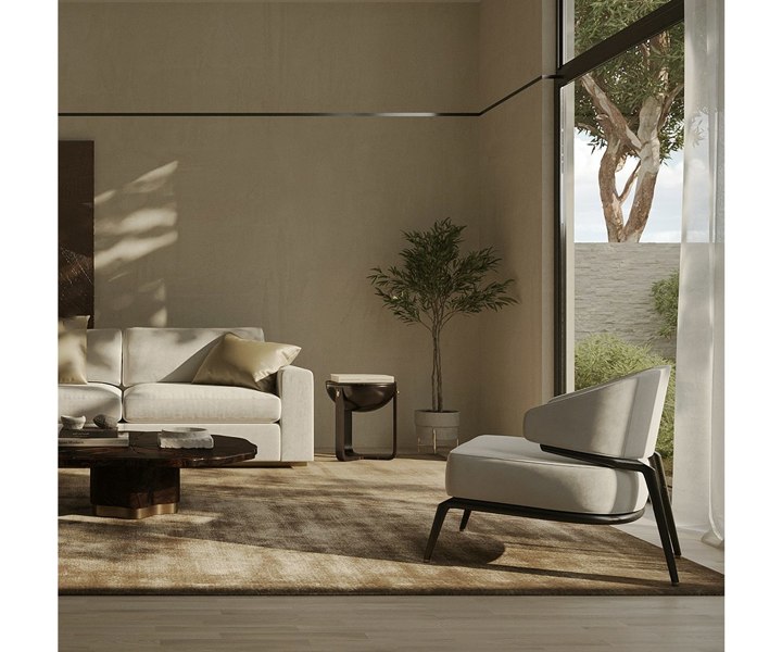 High-end Haines armchair adding sophistication to home decor with its plush seating and oak wood.