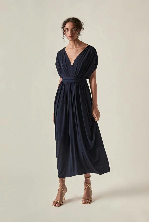 Front view of the Draped Open-Back Midi Dress in Navy by James Lakeland against a studio background