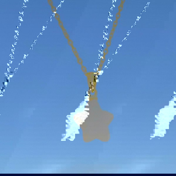 Freshwater Baroque star-shaped pearl on a gold chain necklace by LENAE London.