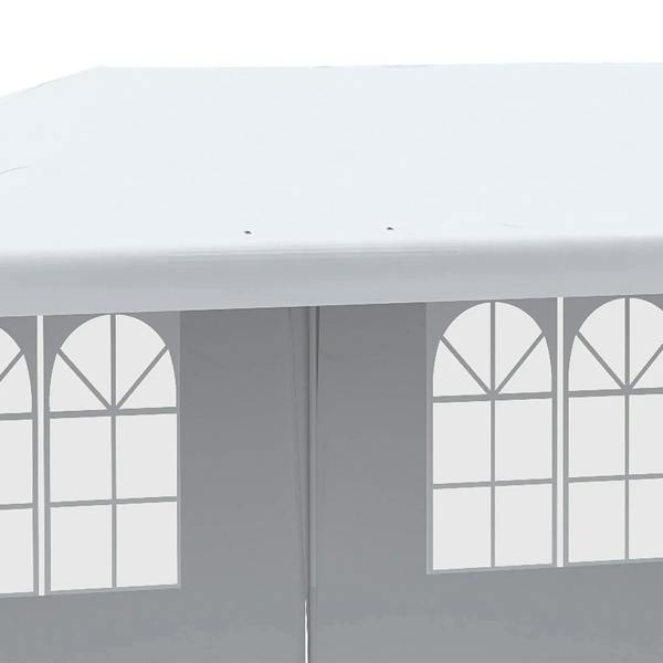 Close-up of white gazebo window panels with arched grid designs on side walls