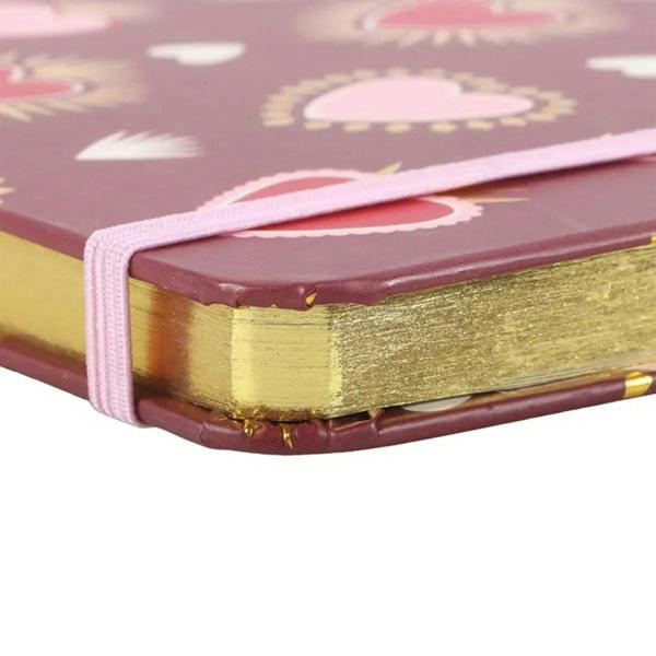 Sacred Heart print A5 notebook spine with pink stitched binding and gold-edged cover