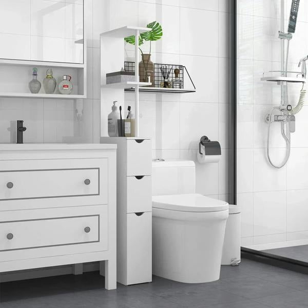 White slim bathroom storage cabinet with open shelves and three drawers beside a shower.