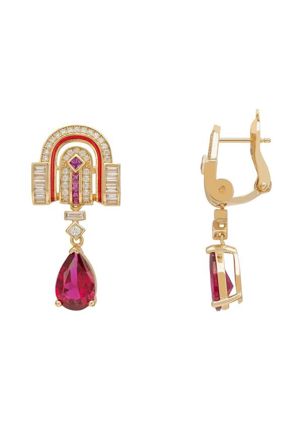 Gold earrings with red gemstones on a white background