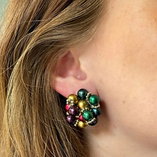 Statement clip-on earrings, multicolour bead cluster, red blue green and gold accents, silver-tone clip fastening, bold vintage-inspired jewellery
