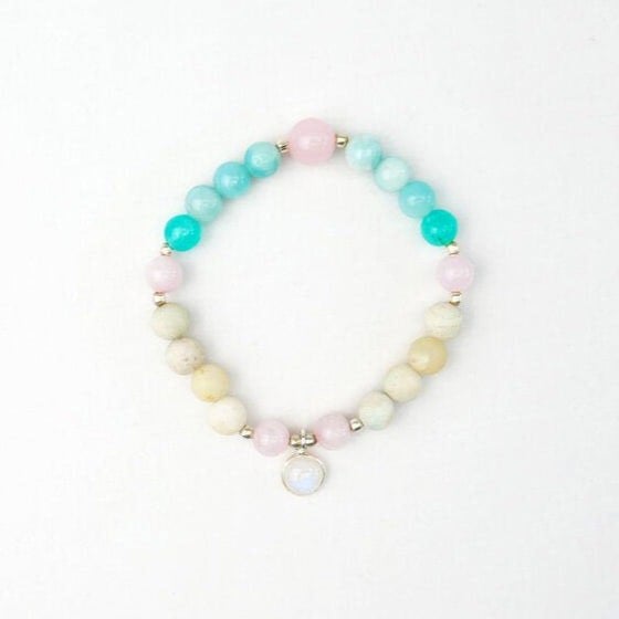Kati Kaia Crystal Mala Necklace featuring pastel blue, pink, and cream beads with a central gemstone charm