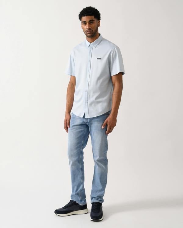 full lenght shot of a model wearing a BOSS Green ST_Motion Mens Short Sleeve Shirt in Open Blue 460