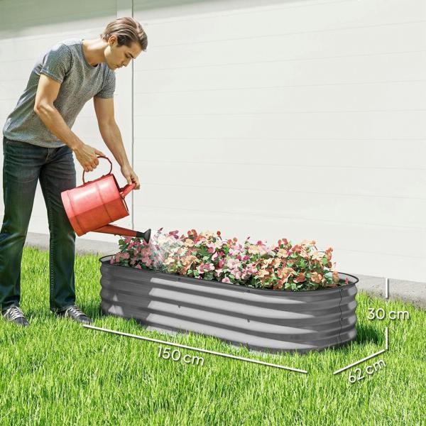 Gray galvanized metal raised garden bed with flowers, on outdoor grass