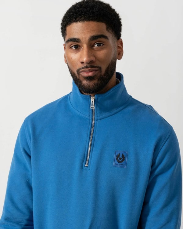 Model wearing Belstaff Quarter Zip Sweatshirt in Marine Blue -  detail