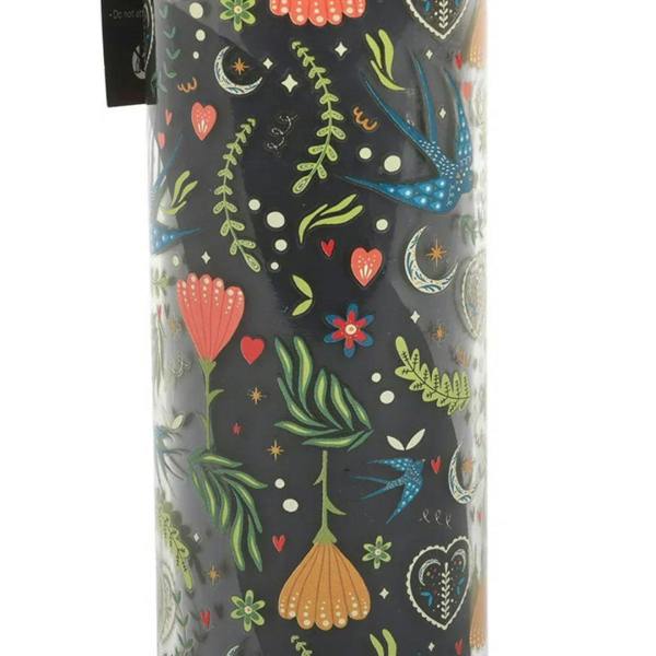 French tulip tube candle close-up: colorful tulips, hearts, and leaves on dark glass
