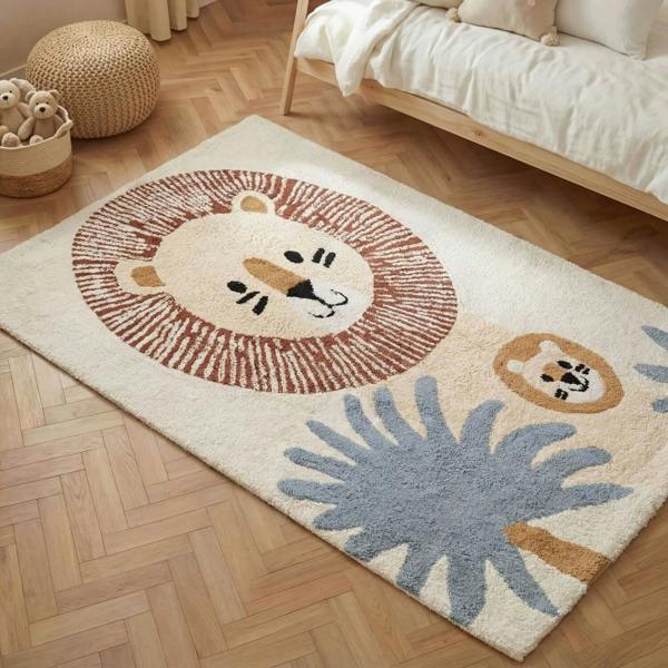 Children's rug with lion design on a wooden floor