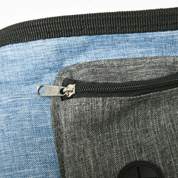 Close-up of blue and gray carry bag with zipper and metal keyring for dog training gear