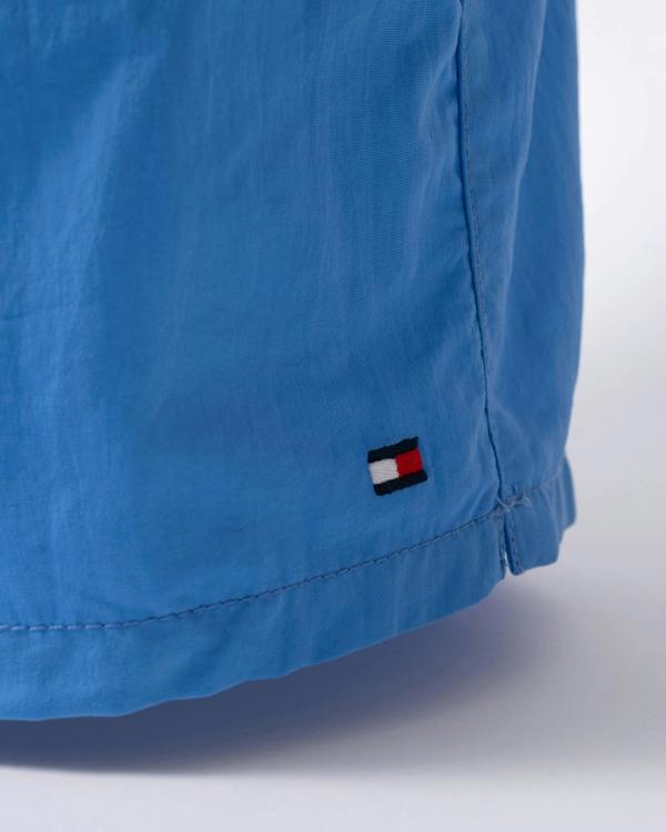 logo detail of of Tommy Hilfiger Solid Mens Drawstring Swimming Shorts in Blue Spell