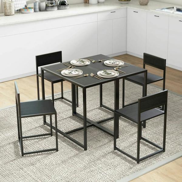 Black rectangular dining table with four matching chairs, tableware on top