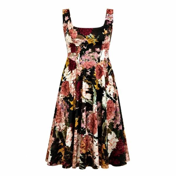The Sarvin Golha Floral Corset Dress is a sleeveless, mid-length skater dress with a fitted bodice, flared skirt, and square neckline in premium jersey. It features a multicolored floral print in red, pink, yellow, green, and black.