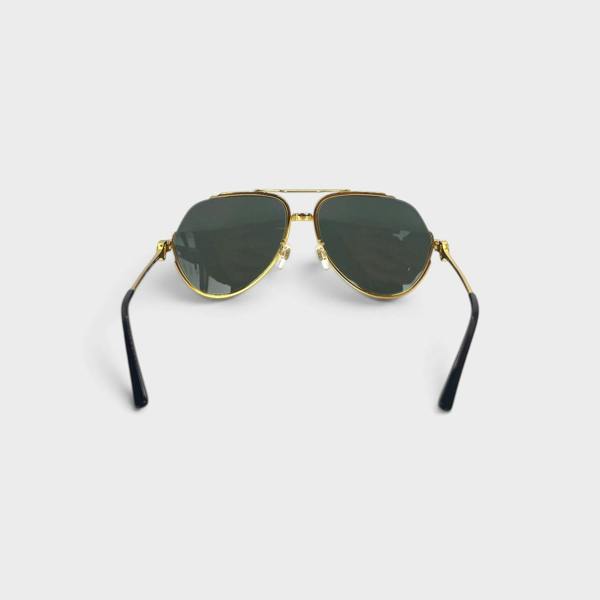 Supplied Fashion rounded frame sunglasses with gold metal rims, black temple tips, and dark UV-protective lenses.