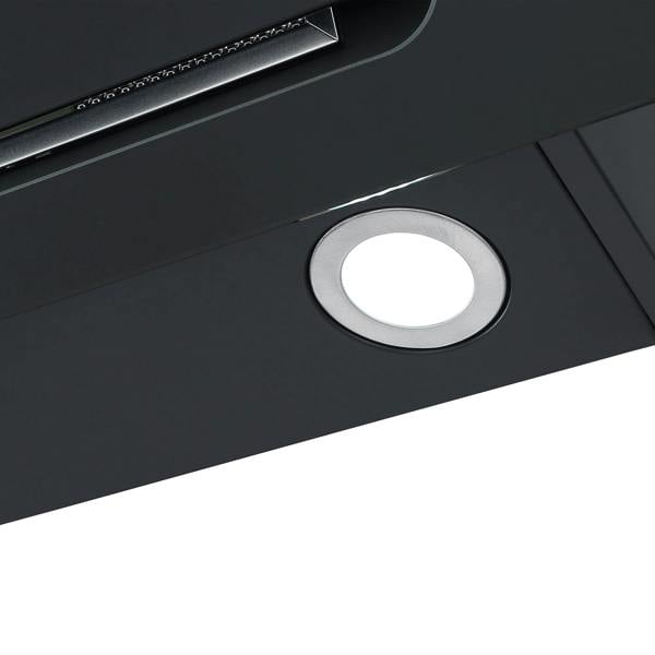 Close-up of a round, silver LED light embedded in the glossy black Igenix 60CM Chimney Cooker Hood, a modern kitchen appliance by Igenix.