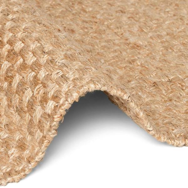 Close-up of a textured beige carpet corner