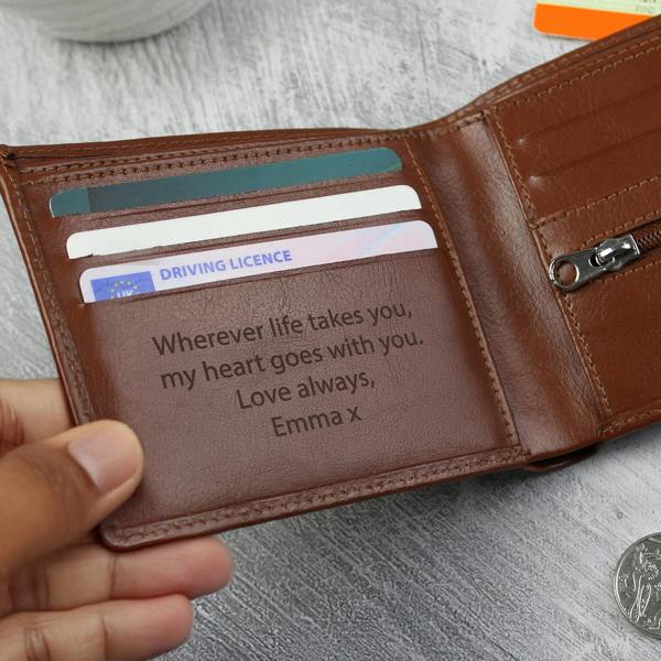 Personalised Brown Leather Wallet: A close-up shot of a high-quality, bi-fold brown leather wallet. The front is custom-engraved with initials, shown resting on a clean, minimalist surface to highlight the natural grain of the leather.