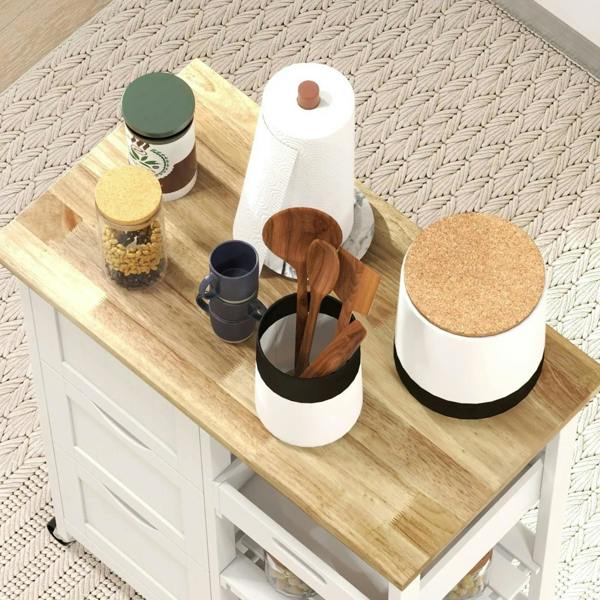 White rolling cart with wood top and countertop organizers with cork lids.