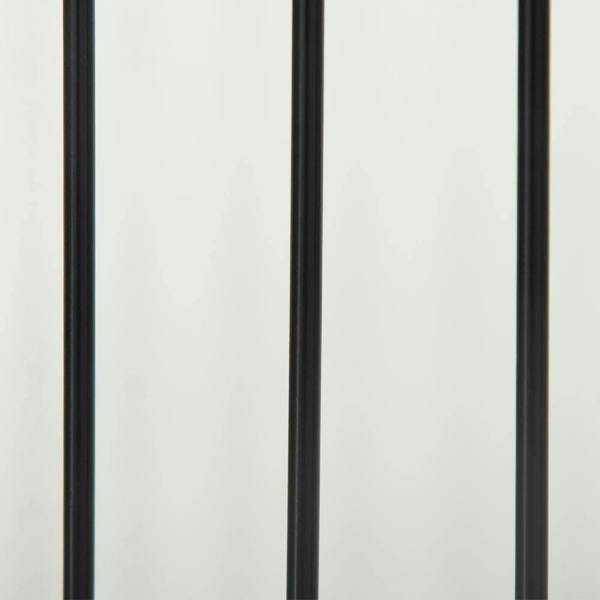 Close-up of white pet gate frame with black vertical bars