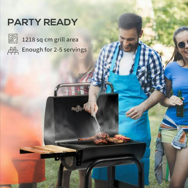 Black charcoal BBQ grill with open lid and food on the cooking grate